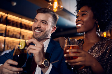 Happy couple socializing in a bar