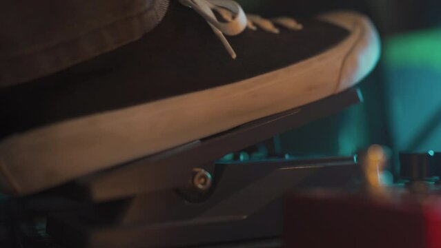 Guitarist using Wah-wah pedal on the floor