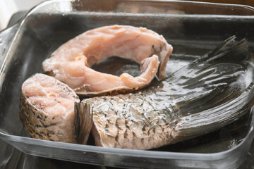 fresh raw fish in glass container, close-up