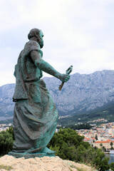Obraz premium Statue of Sint Peter in the forestpark of Makarska, Croatia