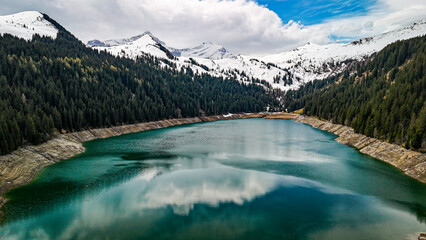 Gstaad Arnensee Lake, Swiss lake, beautiful lake set against a backdrop of mountains.hidden gem in the Swiss Alps