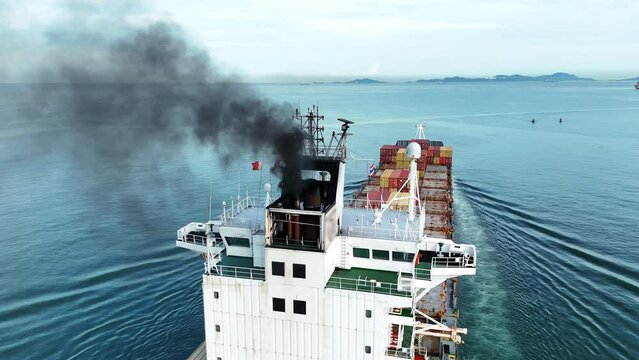 Smoke exhaust gas emissions carbon dioxide from cargo lagre ship container ship,Marine diesel engine exhaust gas from combustion, Gas Emission Air Pollution from transportation. green house effect Eco