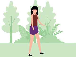 The girl is walking in the forest.