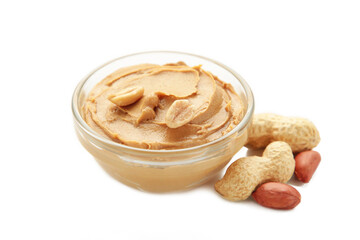 Bowl of peanut butter and peanuts isolated on white background. Creamy peanut pasta in small bowl.