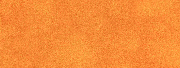 Bright orange matte background of suede fabric, closeup. Velvet texture of seamless brick textile, macro.