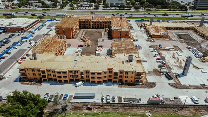 Apartment under construction near Interstate I-35E Stemmons Freeway downtown Dallas, timber wood...
