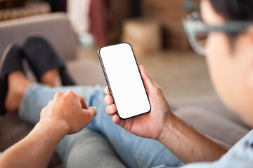 cell phone blank white screen mockup.hand holding texting using mobile on desk at office.background empty space for advertise.work people contact marketing business,technology