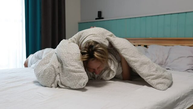 Unmade Bed With White Blanket