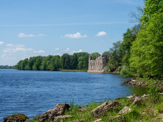 Ruins of an old castle on the river bank. Latvia, Koknese castle. A trip through Europe. Cities of the Hanseatic League   