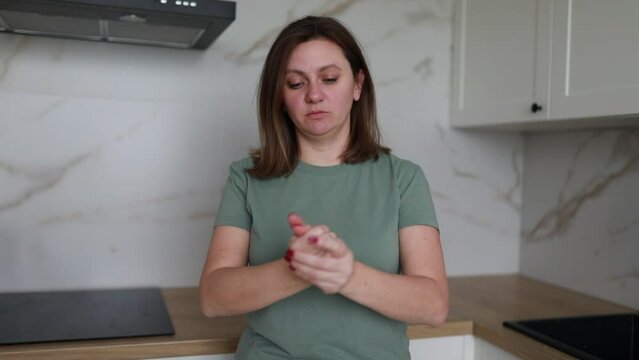 Young Woman Preparing Food in a Modern Kitchen During Daytime