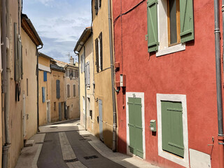 Winding alley with stone walls and arched windows lines a historic France European town