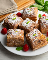 Miguelitos are typical pastries from Spain made from puff pastry, filled with chocolate cream and sprinkled with sugar.