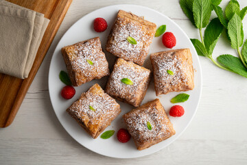 Miguelitos are typical pastries from Spain made from puff pastry, filled with chocolate cream and sprinkled with sugar.
