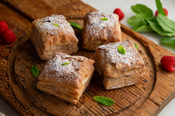 Miguelitos are typical pastries from Spain made from puff pastry, filled with chocolate cream and sprinkled with sugar.