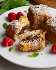 Miguelitos are typical pastries from Spain made from puff pastry, filled with chocolate cream and sprinkled with sugar.