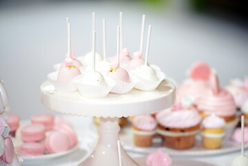 Colorful wedding cup cakes decoration on table.

