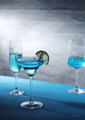 Glasses with blue alcohol cocktail ready for a party	