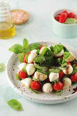 A plate with Italian salad caprese canape