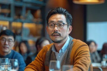 Fototapeta premium Man seated table glass water