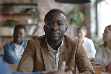 Fototapeta premium Man seated among diverse group