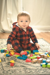baby toddler playing color cubes toys at home or nursery