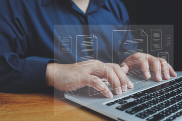 Document management system (DMS) technology, businessman use laptop with database folder online to...