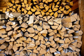 Background or backdrop made of chopped birch firewood