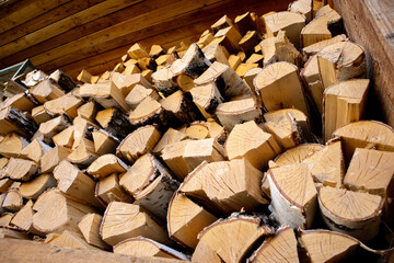 Birch firewood is stacked in a neat stack