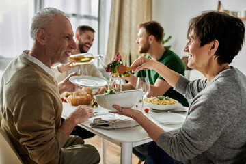 A gay couple enjoys dinner with parents, showcasing a heartwarming moment of family acceptance.