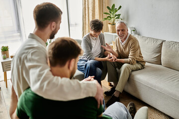 A gay couple introduces their partners to parents in a heartwarming scene.