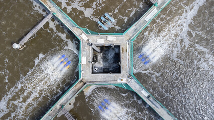Aerial view of water circulation in a shrimp pond located on the beach