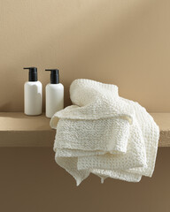 white waffle towel with shower products