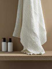 white waffle towel with shower products