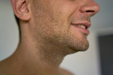 Obraz premium chin with bristles of a thirty-year-old man of a medium build