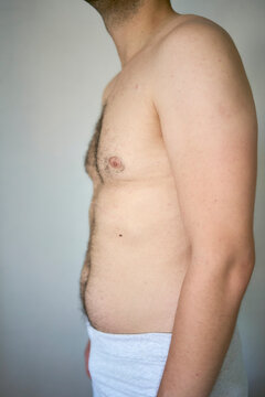 the side and stomach of a thirty-year-old man of average build