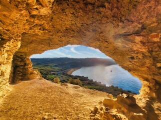 Road to the desert. View from the rocks of the mountains and the sea with beautiful clouds at sunset.  Inside of mainsail. The cliff is currently destroyed