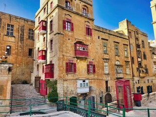Fototapeta premium Traditional balconies on the houses. A street. View of the city, architecture, channels. Here in particular a look of their alleys. Houses in the historical part of the city. Lifestyle of people