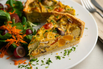 French quiche with fall vegetables such as brussels sprouts, sweet potato, and mushrooms.