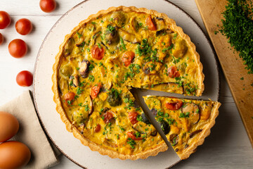 French quiche with fall vegetables such as brussels sprouts, sweet potato, and mushrooms.