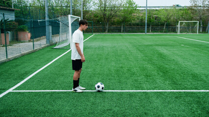 Teenager Does Freestyle Soccer Dribbles In The Field
