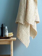 white waffle towel with shower products