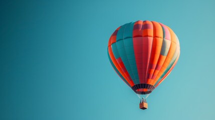 Fototapeta premium A colorful hot air balloon floats high in the sky