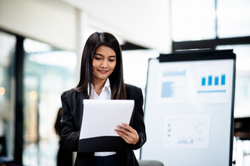 Professional businesswoman working on laptop and document and calculator about business accounting financial and marketing