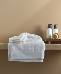 white towels on the bathroom shelf