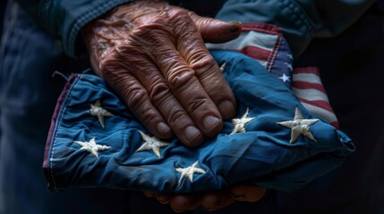 Obraz premium veteran's hand holding a folded American flag, representing the respect and reverence for those who have served and sacrificed for their country. 