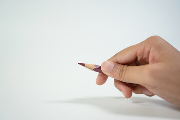 Female hand holding pencil isolated on white background, Cliping Path.