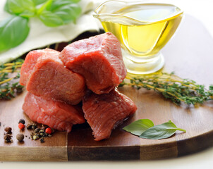 fresh raw meat on a wooden board