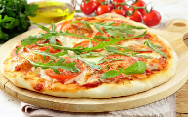 traditional pizza with tomatoes and basil