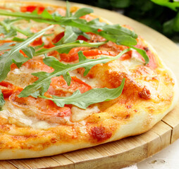 traditional pizza with tomatoes and basil