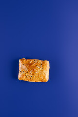 Minimalist Tandoor-Baked Chicken Samsa on Blue Background